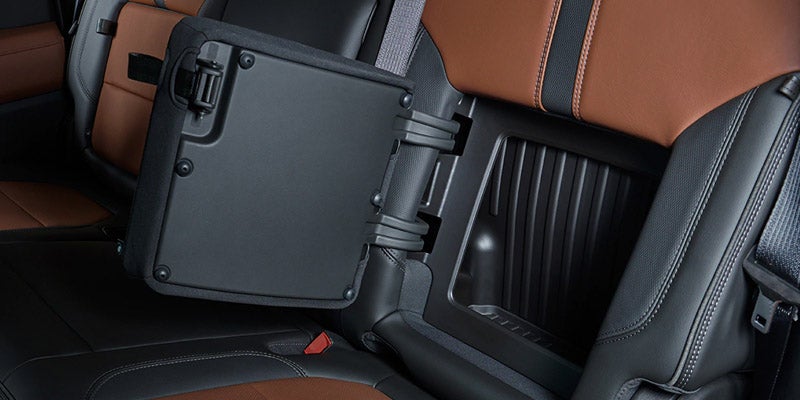 Chevrolet Silverado 1500 rear seat folded showing hidden storage compartment